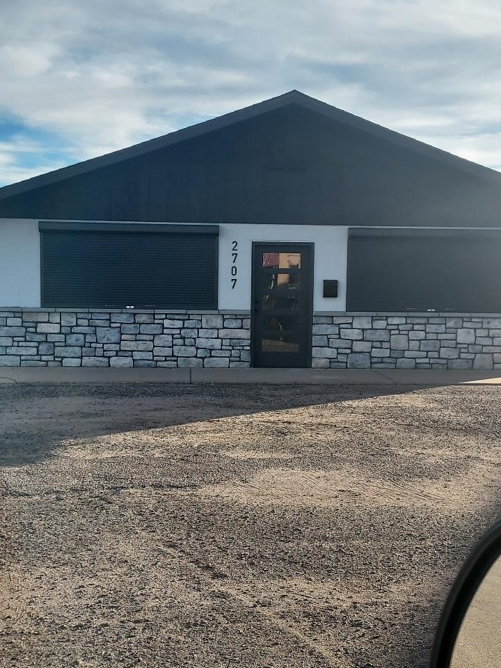 Stone veneer repair and remodel on building exterior